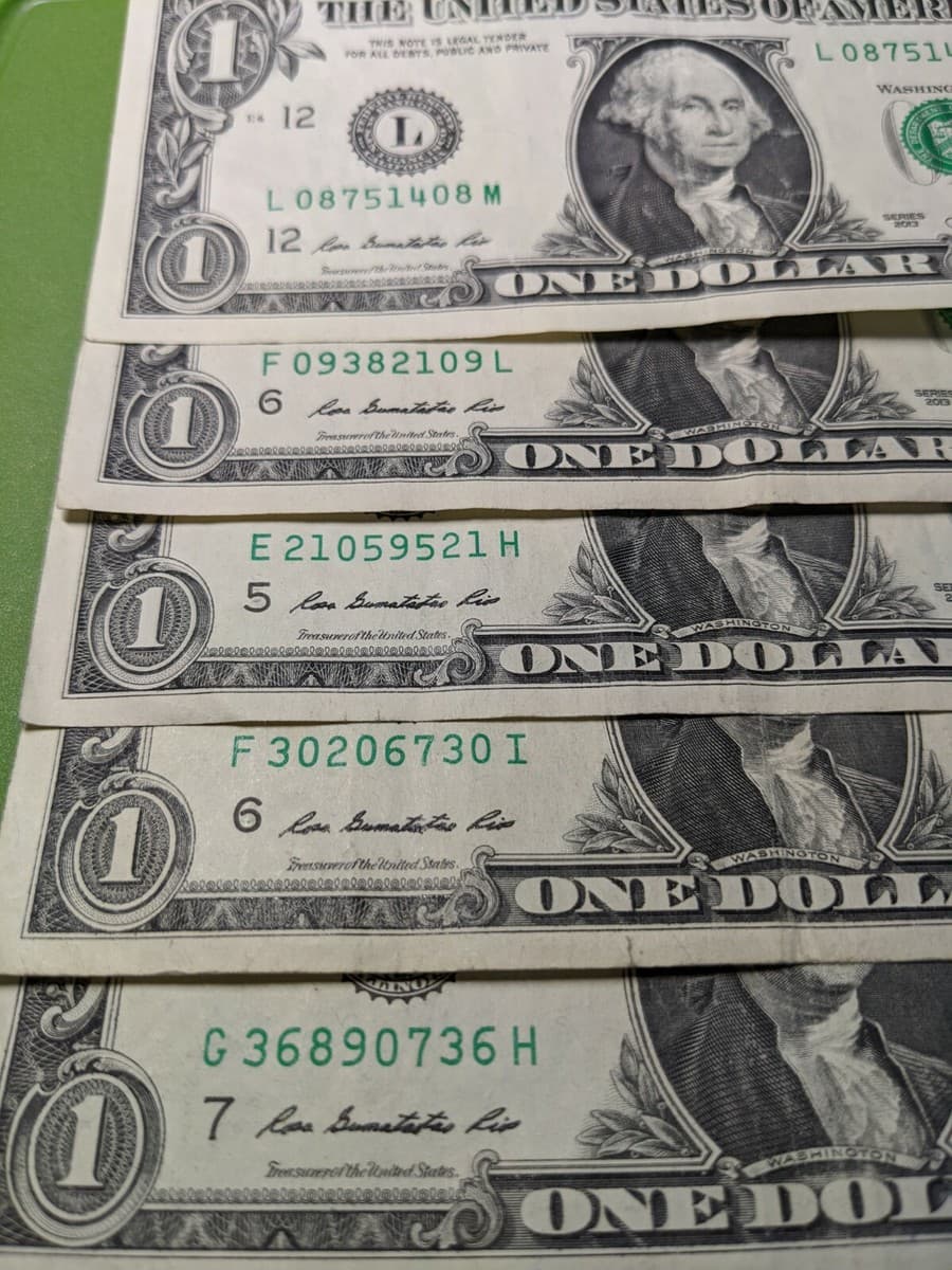Bookends dollar bill with matching 08 ends in serial 08751408