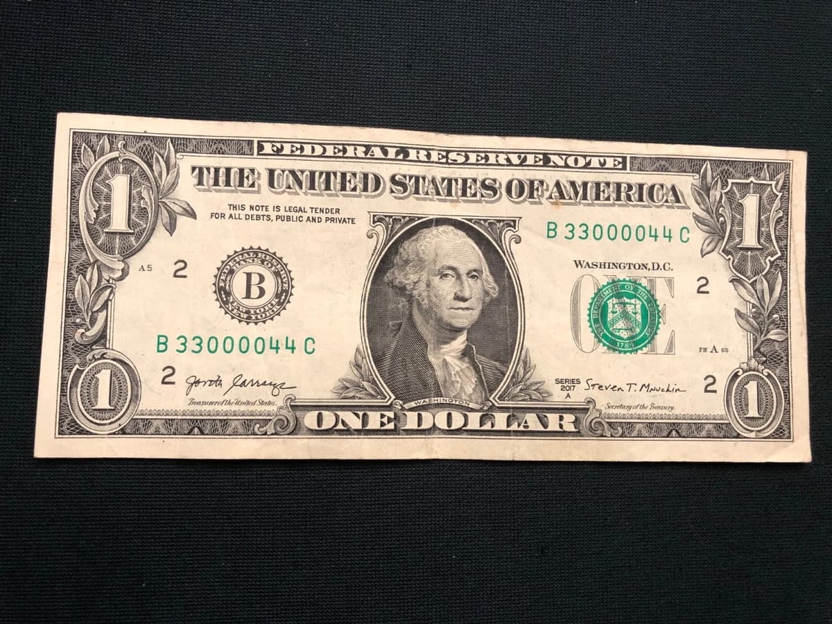 Quad Doubles dollar bill showing four pairs in serial 33000044